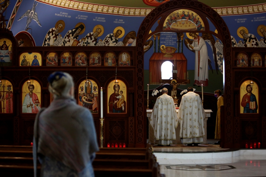 The Rev. Alex Karloutsos, vicar-general for the Greek Orthodox Archdiocese of America, and the Rev. Constantine Lazarakis lead worship at the Formation of the Virgin Mary Greek Orthodox Church of the Hamptons on Sunday, Aug. 29, 2021, in Southhampton, N.Y. In the hours and days after the Sept. 11, 2001 attacks, Karloutso was among clergy offering spiritual support to emergency responders in the hours and days after the Sept. 11, 2001 attacks and has since played a significant role in the reconstruction of St. Nicholas Greek Orthodox Church and National Shrine at ground zero.