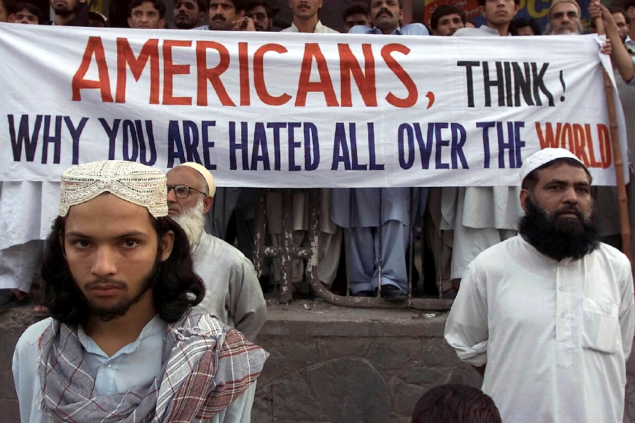 In this Saturday, Sept. 15, 2001 file photo, activists of Pakistan militant religious parties stand with a banner which reads, 