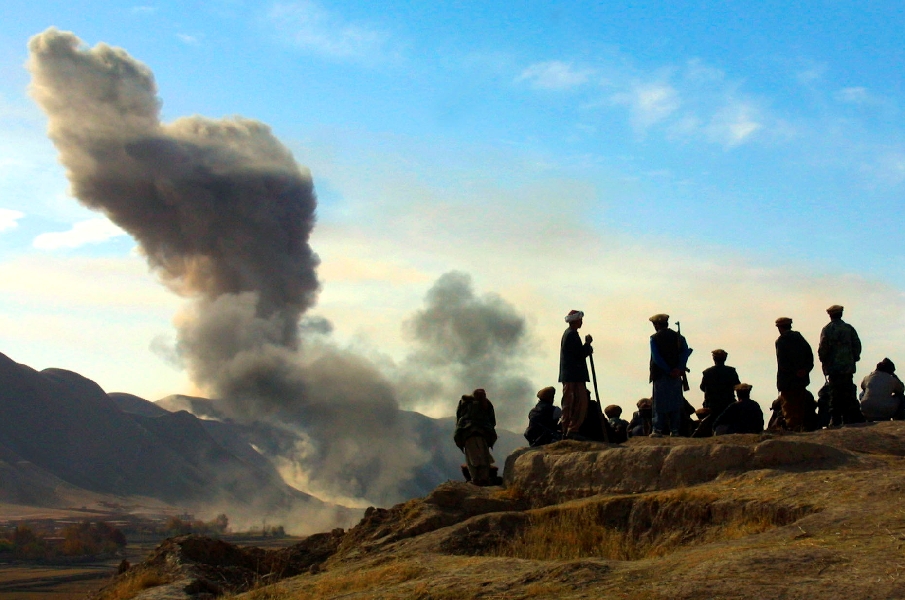 In this Nov. 19, 2001 file photo, Northern Alliance soldiers watch as U.S. air strikes attack Taliban positions in Kunduz province, Afghanistan.