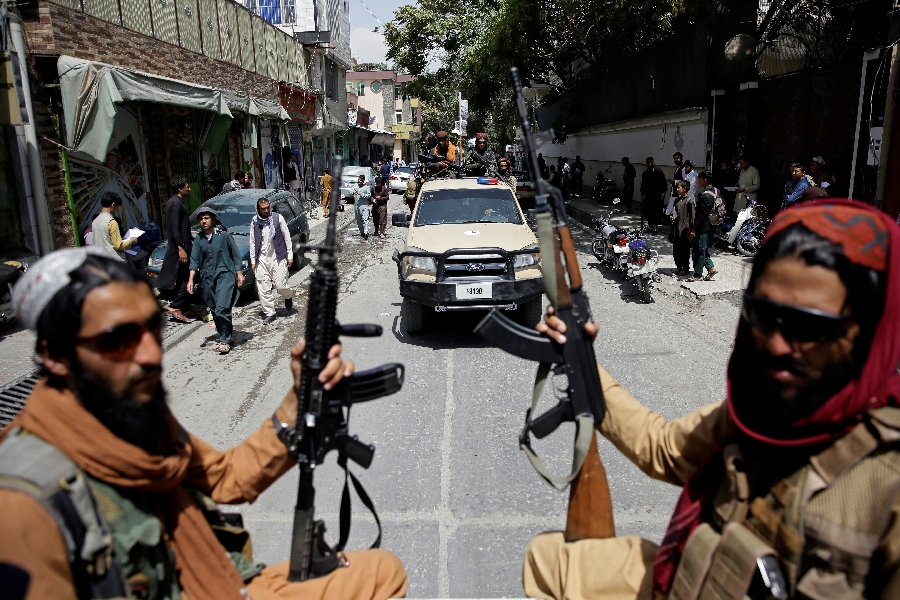 In this Thursday, Aug. 19, 2021 file photo, Taliban fighters patrol Kabul, Afghanistan,. The Taliban celebrated Afghanistan's Independence Day on Thursday by declaring they beat the United States, but challenges to their rule ranging from running a country severely short on cash and bureaucrats to potentially facing an armed opposition began to emerge.