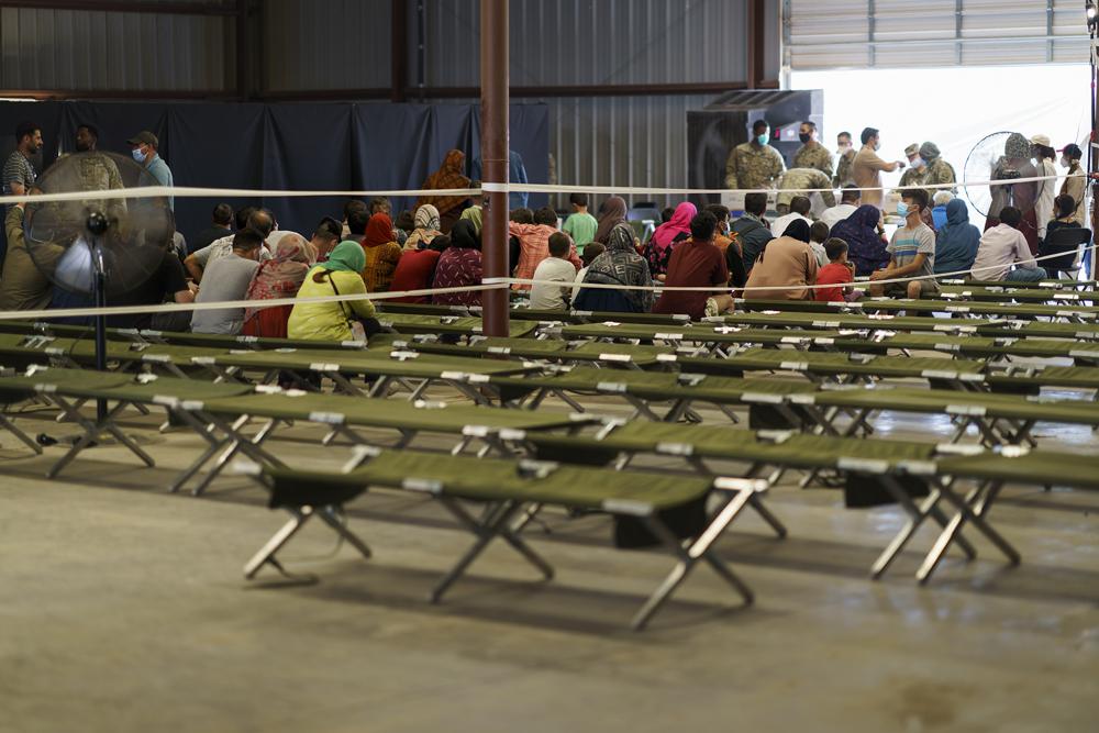 Afghan refugees are processed at Fort Bliss' Doña Ana Village where they are being housed, in New Mexico, Friday, Sept. 10, 2021. The Biden administration provided the first public look inside the U.S. military base where Afghans airlifted out of Afghanistan are screened, amid questions about how the government is caring for the refugees and vetting them.