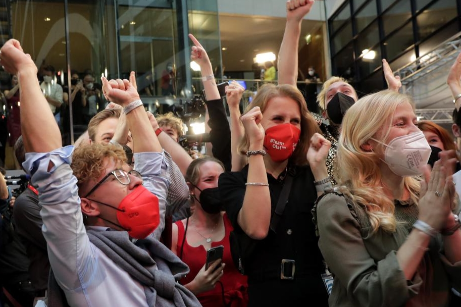 Supporters react at the Social Democratic Party, SPD, headquarters in Berlin
