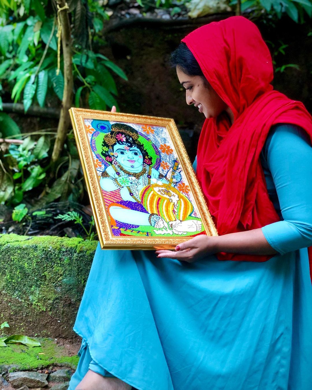 muslim woman painting sri krishna
