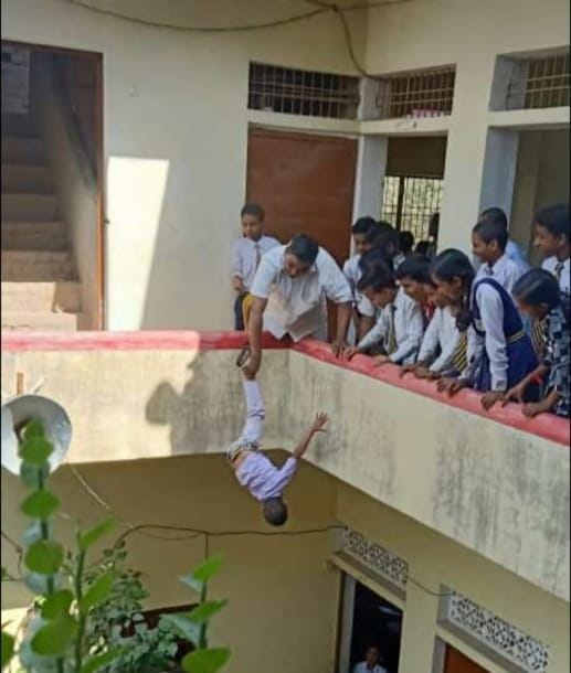 Principal hangs kid upside down from building in UP