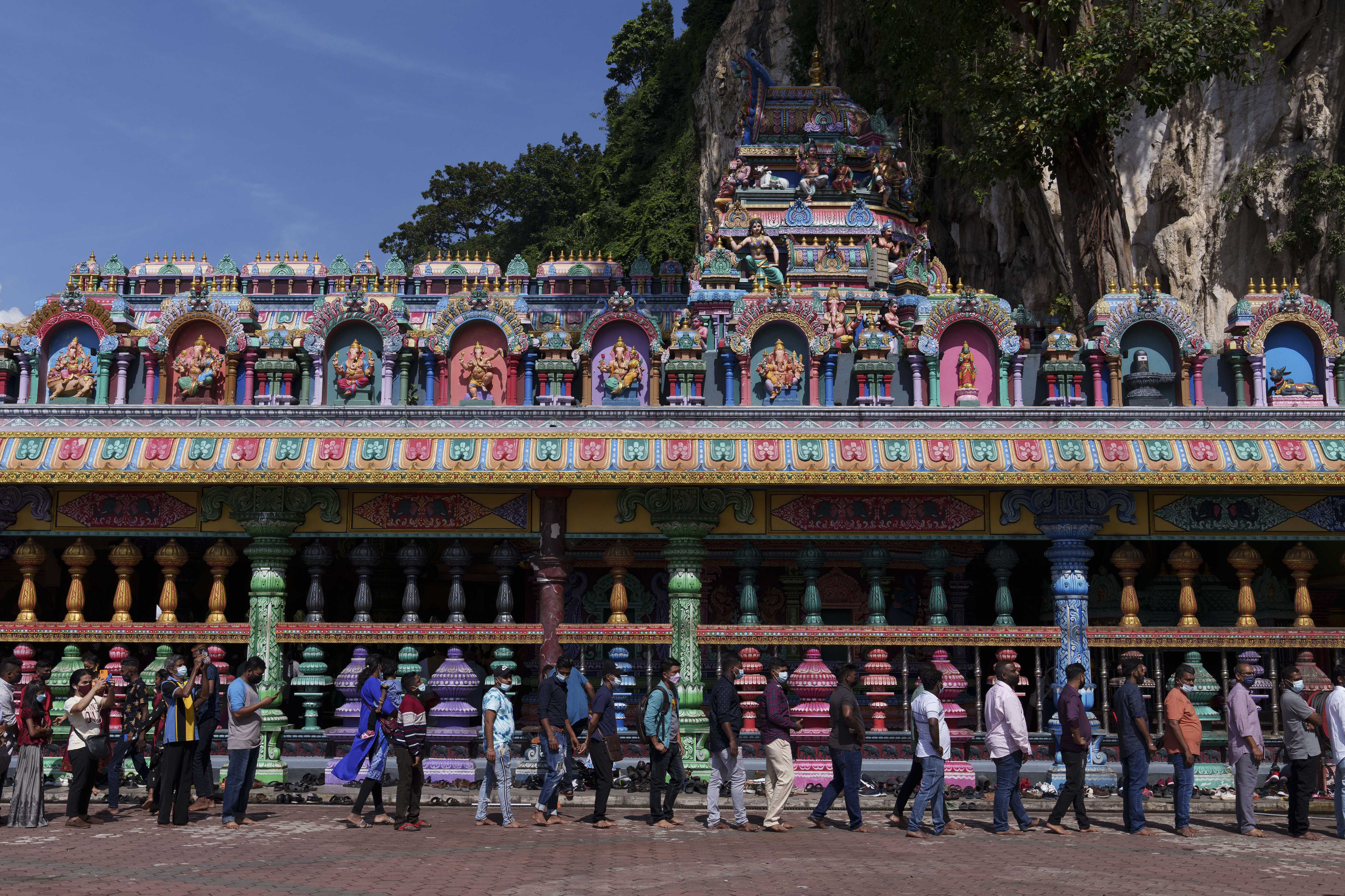 Hindu devotees pray at the Batu Caves