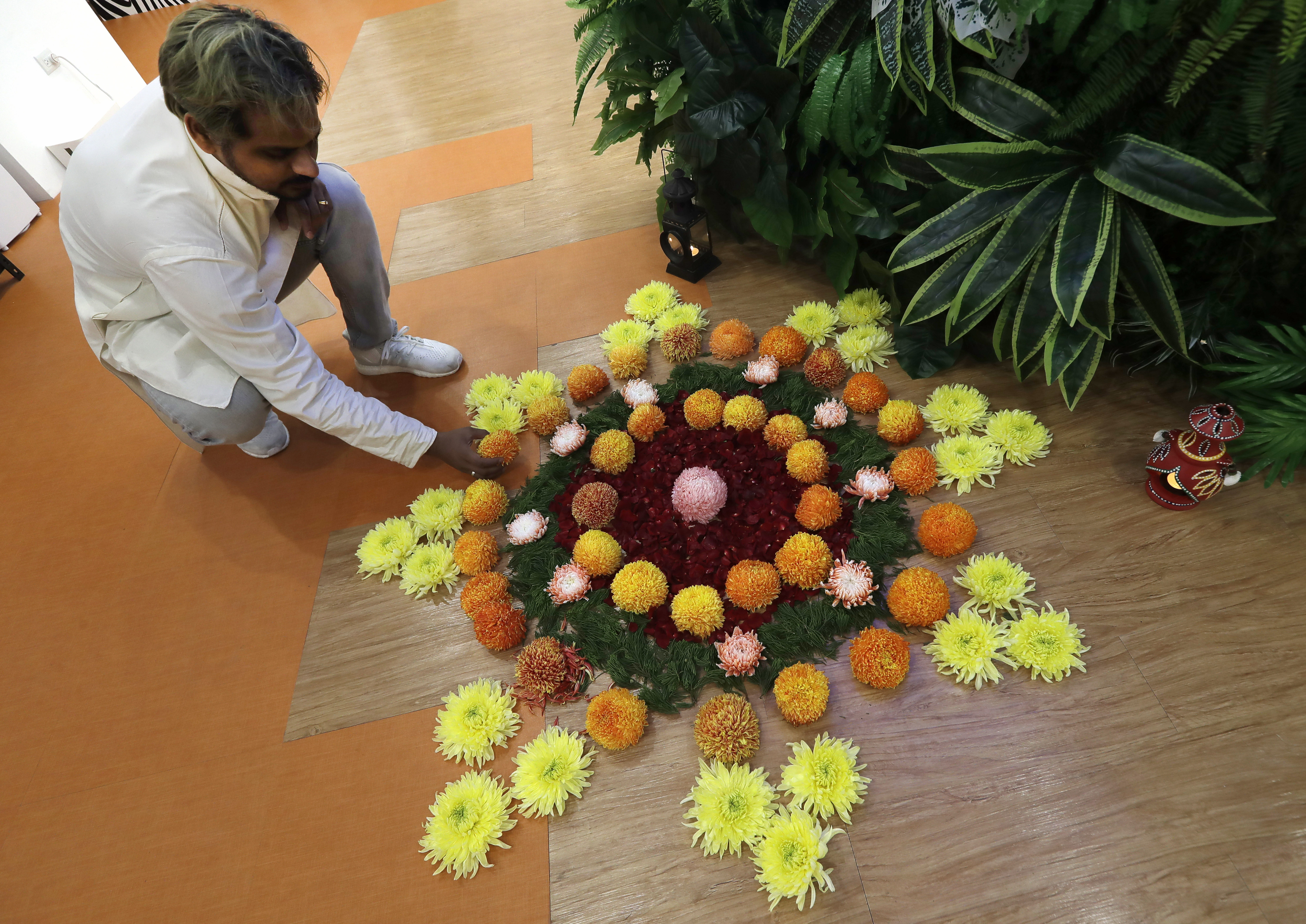 An Indian living in Taiwan decorates with flowers during Diwali