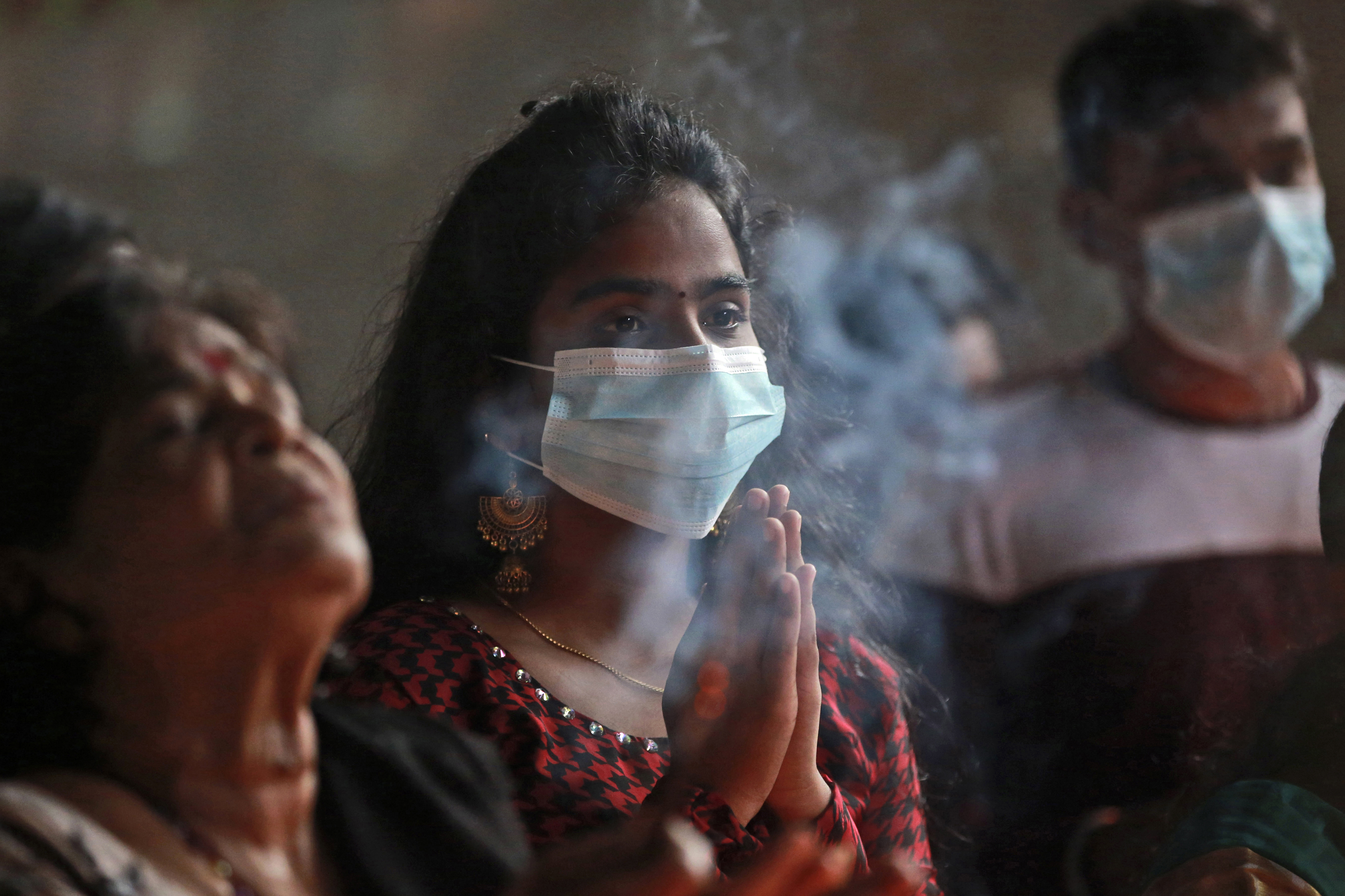 Devotees offer a prayer during Diwali Indonesia