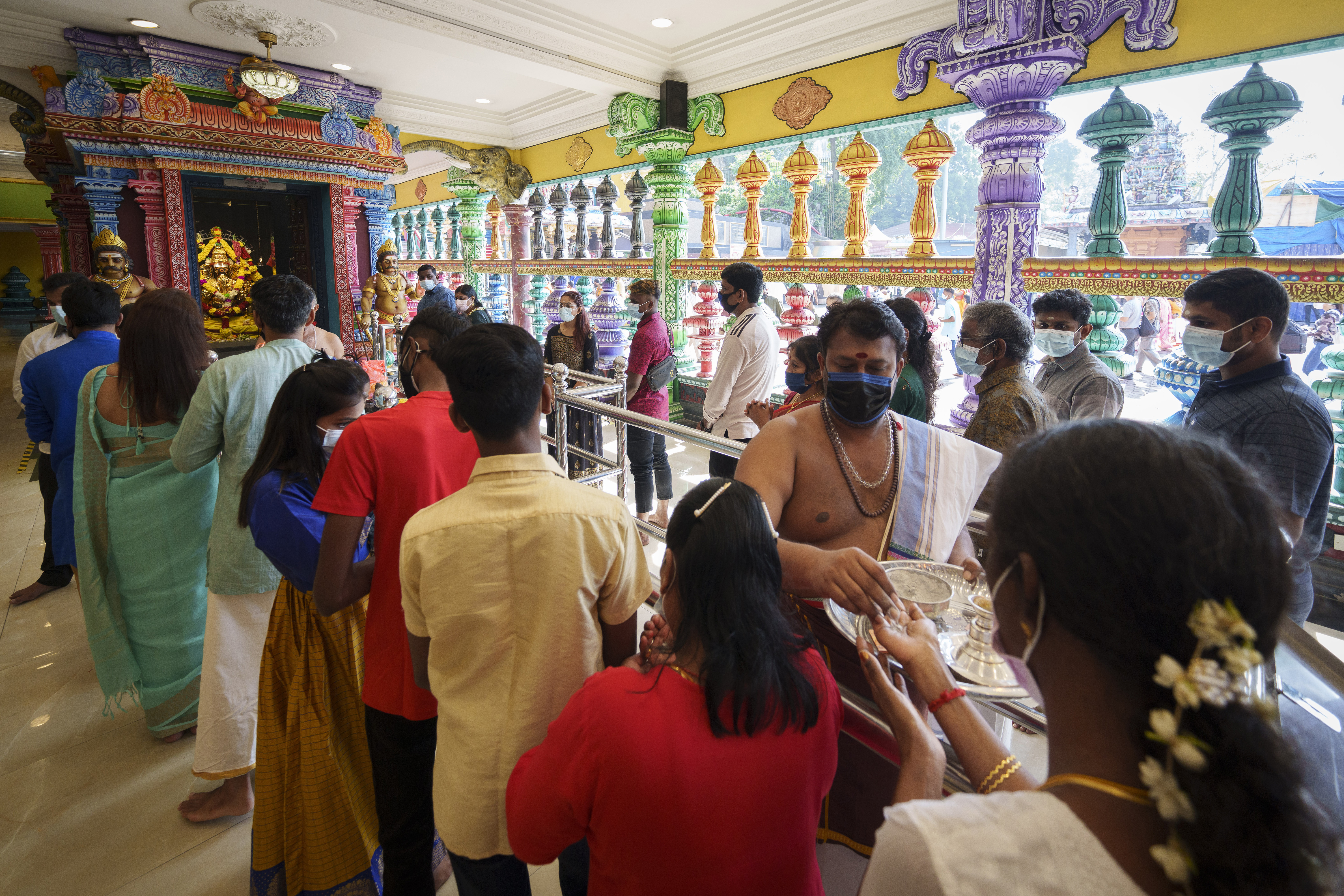 Hindu devotees pray at the Batu Caves