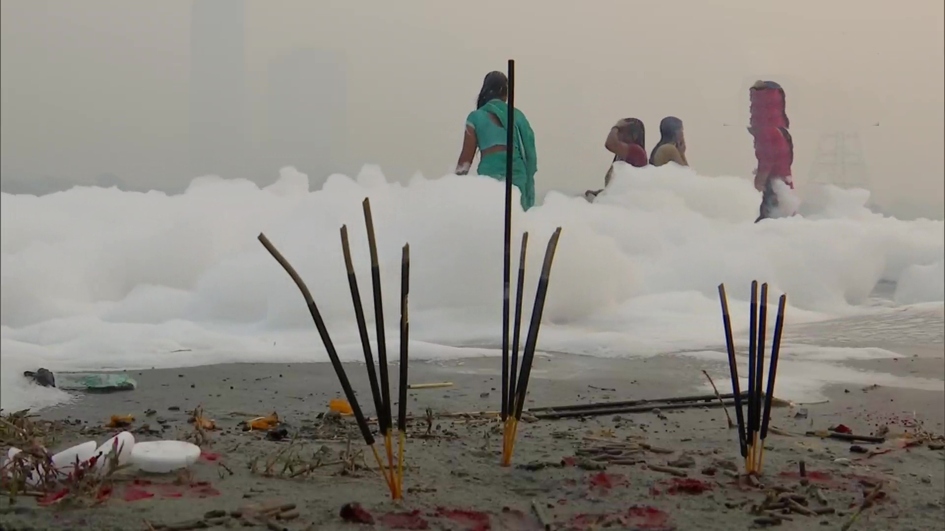 people take dip in yamuna river