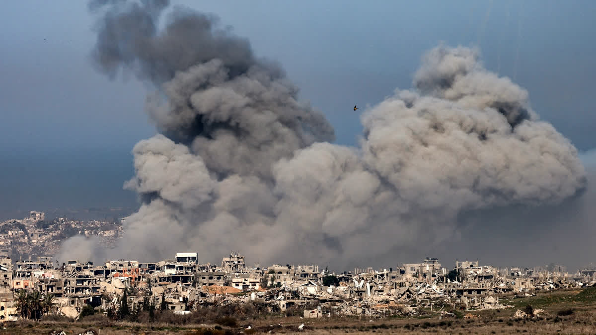 This picture taken from the Israeli side of the border with the Gaza Strip shows smoke plumes rising from explosions above destroyed buildings in the northern Gaza Strip on January 13, 2025 amid the ongoing war between Israel and Hamas.