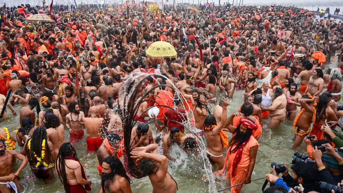 'Sadhus' take a holy dip at Sangam on the occasion of 'Makar Sankranti' during the Maha Kumbh Mela 2025, in Prayagraj, Uttar Pradesh, Tuesday, Jan. 14, 2025.