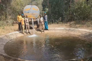 Foresters fill the water tanks for forest animals in Tiruvannamalai