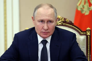 Vladimir Putin urges Russians to take part in presidential polls.