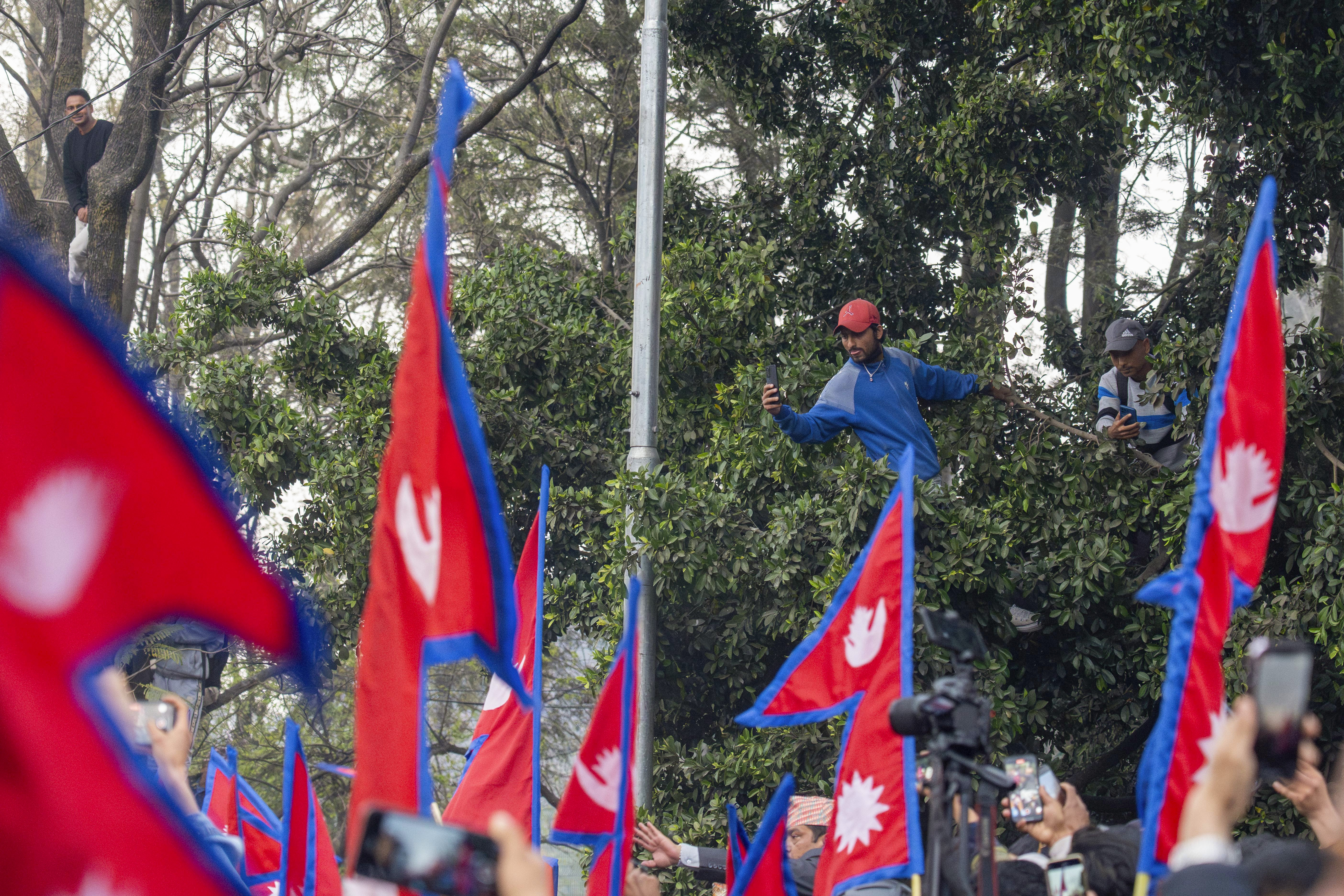 Supporters gather to welcome Nepal's former King Gyanendra Shah upon his arrival at Tribhuvan International Airport in Kathmandu
