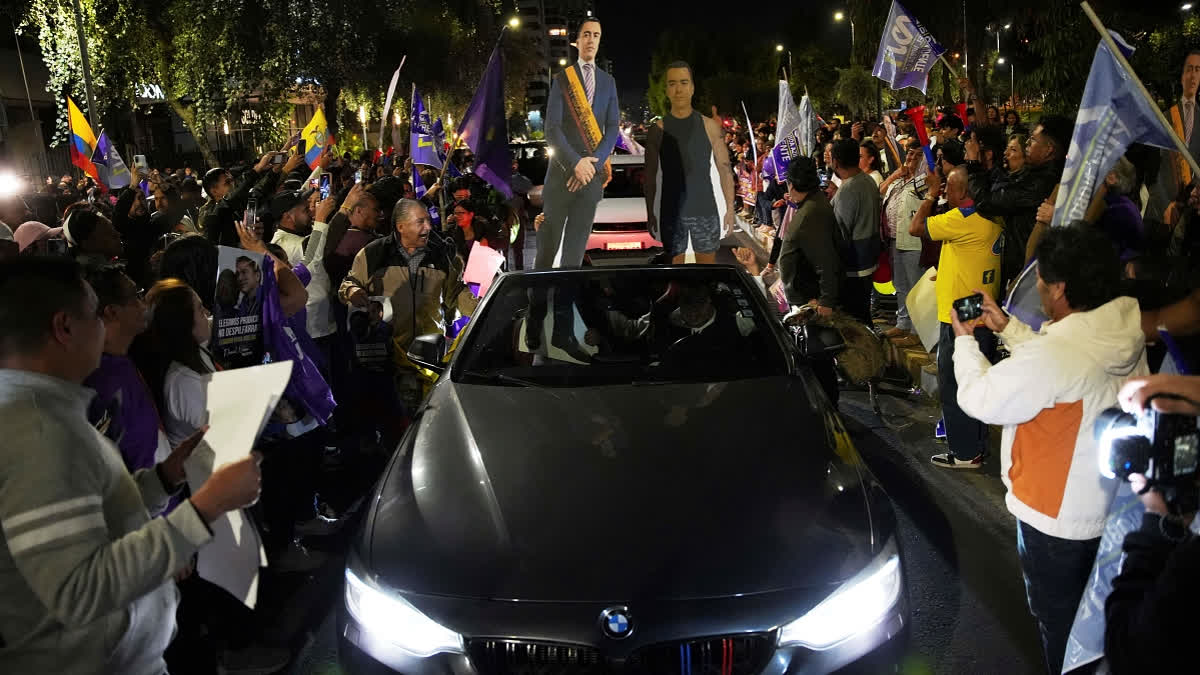 Supporters of President Daniel Noboa celebrate early returns showing him in the lead in the presidential election runoff in Quito, Ecuador, Sunday, April 13, 2025.