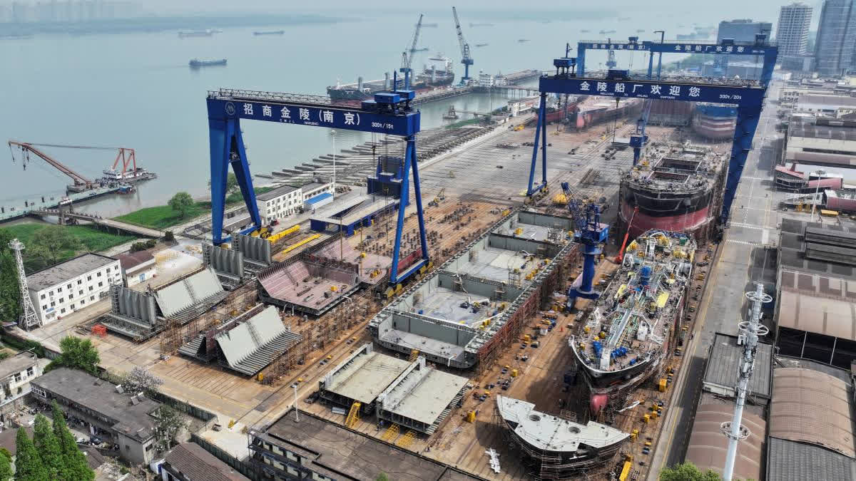 China's March exports surged 12.4% as companies rushed to beat US tariffs, though analytics warn of sharp declines ahead due to trade tensions.