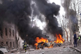 In this photo provided by the Ukrainian Emergency Service, firefighters put out the fire following Russia's missile attack that killed at least 20 civilians in Sumy, Ukraine, Sunday, April 13, 2025.