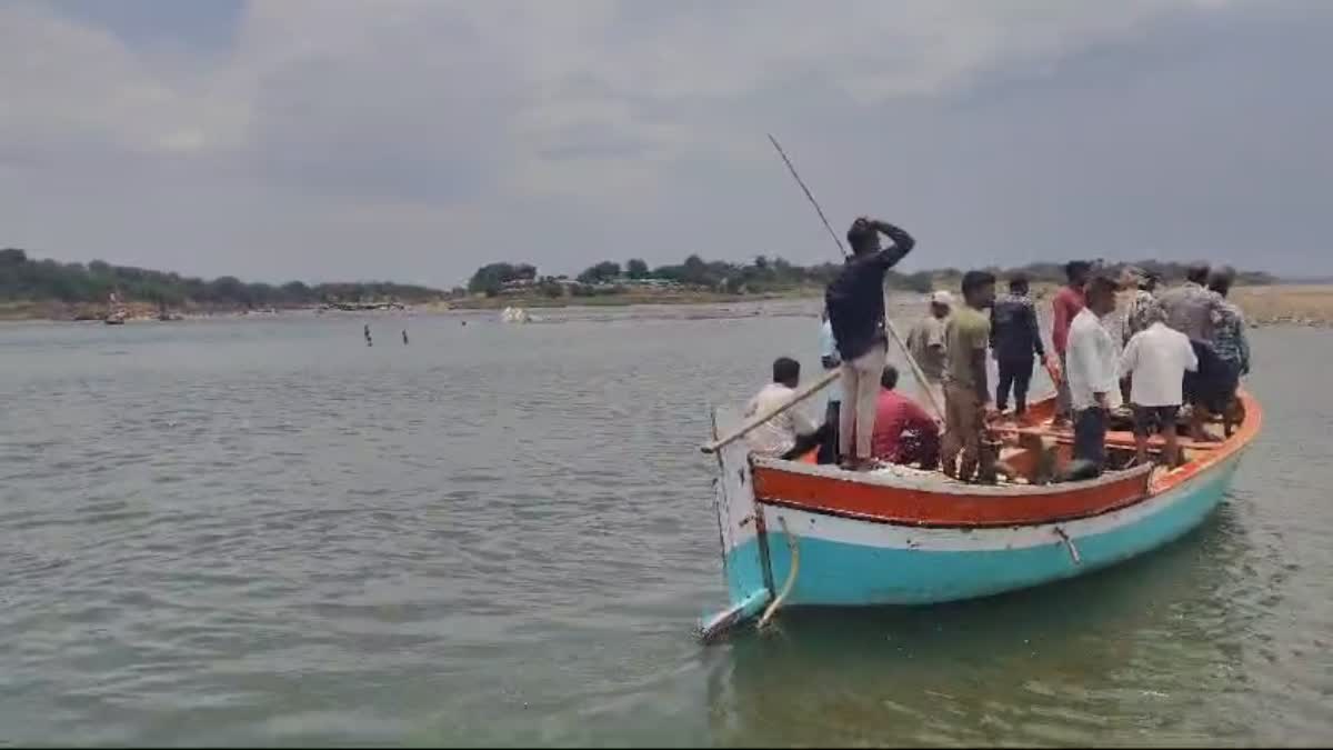 Searching for missing people in Gujarat's Narmada river.