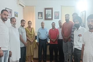 Rattan Lal Gupta Provincial President Jammu Province (C) poses with party workers in Jammu on Friday June 14, 2024