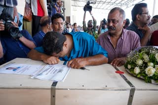 A Man Breaks Down As The Mortal Remains Of Kuwait fire Victims.