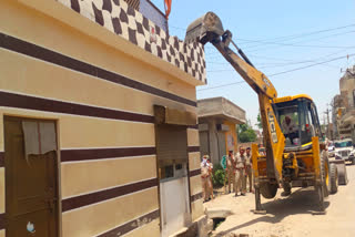 Bulldozer action on illegal occupation