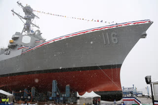 FILE - The future USS Thomas Hudner, a U.S. Navy destroyer named after Korean War veteran Thomas Hudner, during christening ceremony at Bath Iron Works in Bath, Maine, April 1, 2017. The ship was commissioned, Dec. 1, 2018 in Boston.