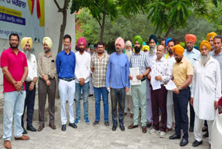 Protest against filing of papers against college professor in Barnala
