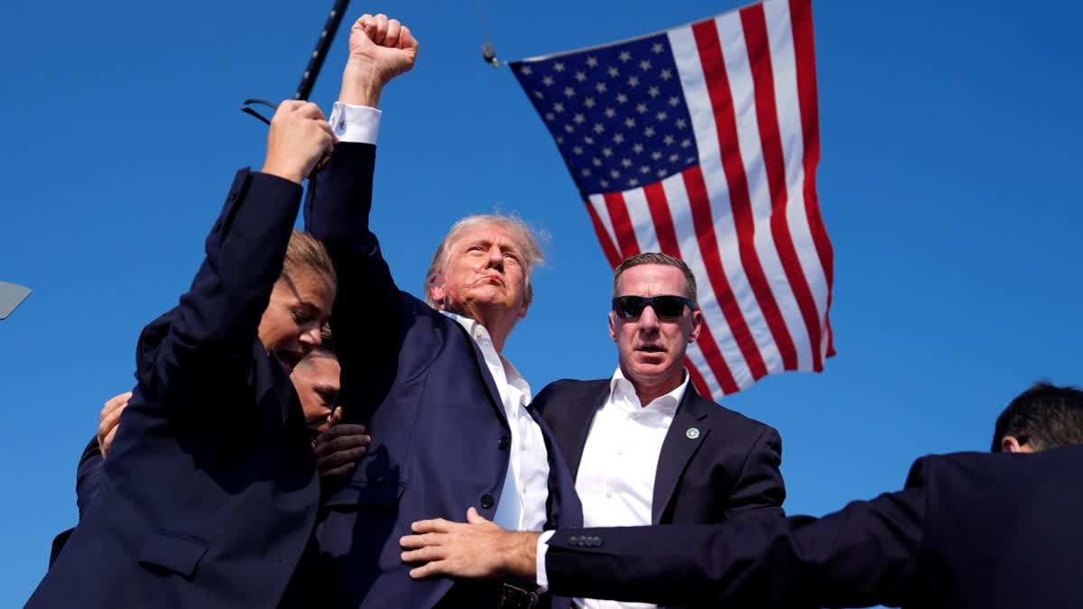 Republican presidential candidate former President Donald Trump is surround by U.S. Secret Service agents at a campaign rally, Saturday, July 13, 2024, in Butler, Pa.