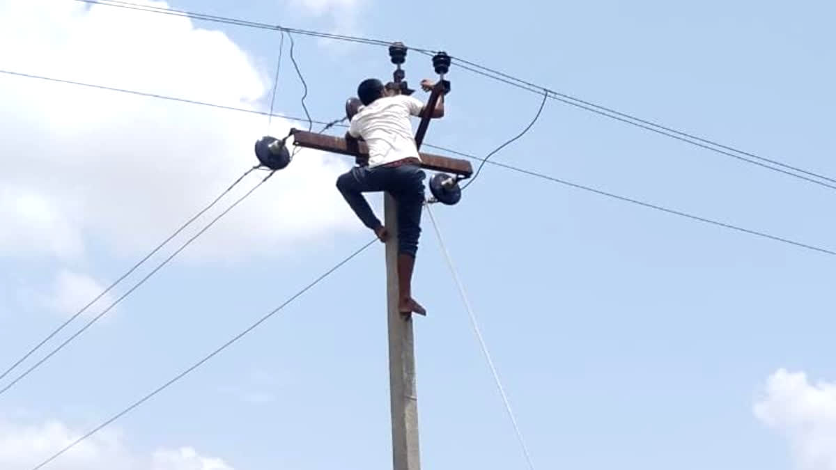 Young man climbed on live electricity pole