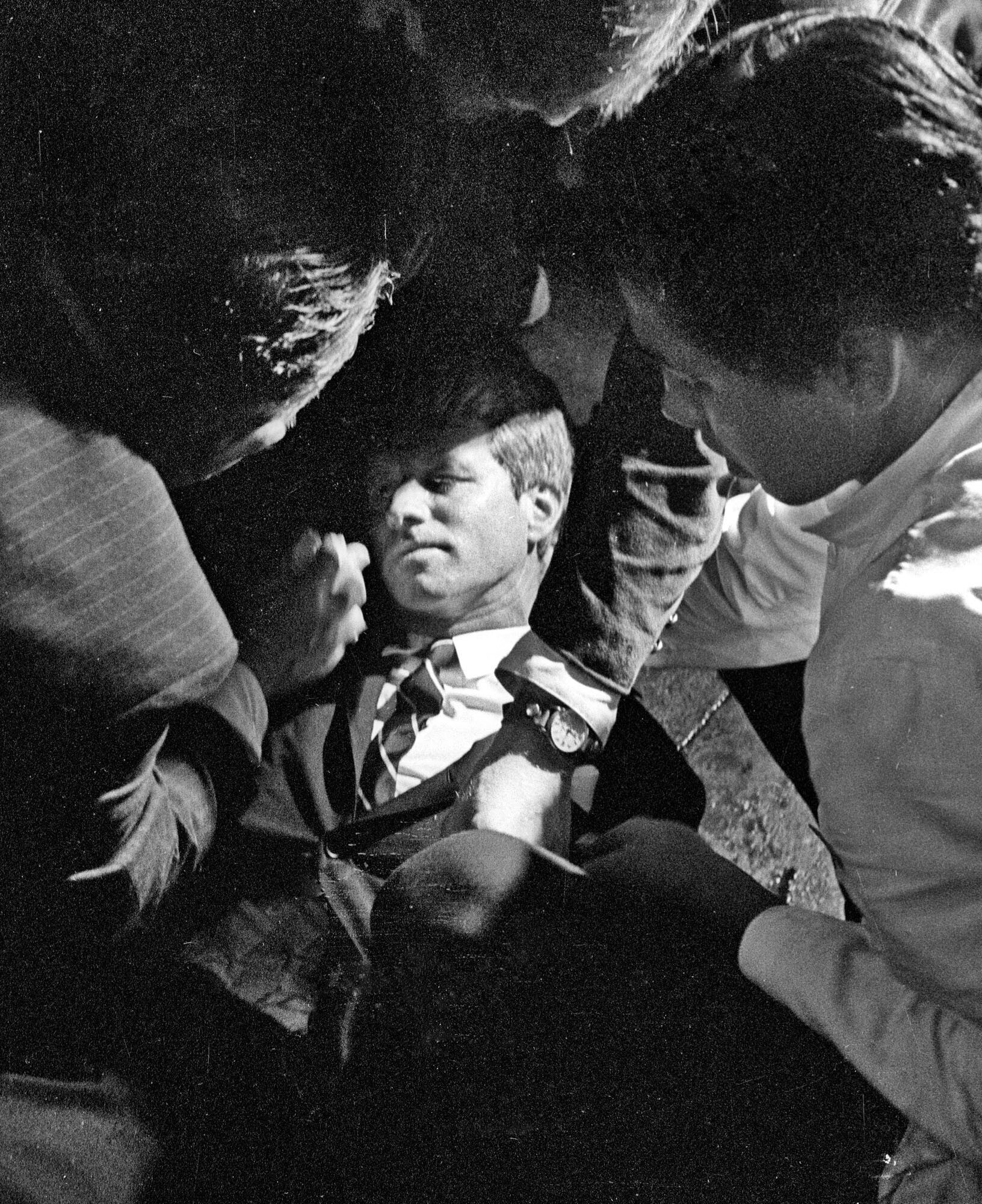 In this June 5, 1968 file photo, Hotel busboy Juan Romero, right, comes to the aid of Senator Robert F. Kennedy, as he lies on the floor of the Ambassador hotel in Los Angeles moments after he was shot. Romero was a teenage busboy in June 1968 when Kennedy walked through the Ambassador Hotel kitchen after his victory in the California presidential primary and an assassin shot him in the head. He held the mortally wounded Kennedy as he lay on the ground, struggling to keep the senator's bleeding head from hitting the floor.