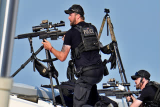 Police snipers return fire after shots were fired while Republican presidential candidate former President Donald Trump was speaking at a campaign event in Butler, Pa., on Saturday, July 13