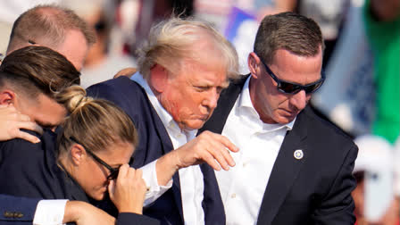 Republican presidential candidate former President Donald Trump is helped off the stage at a campaign event in Butler, Pa., Saturday, July 13, 2024