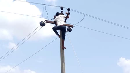 Young man climbed on live electricity pole