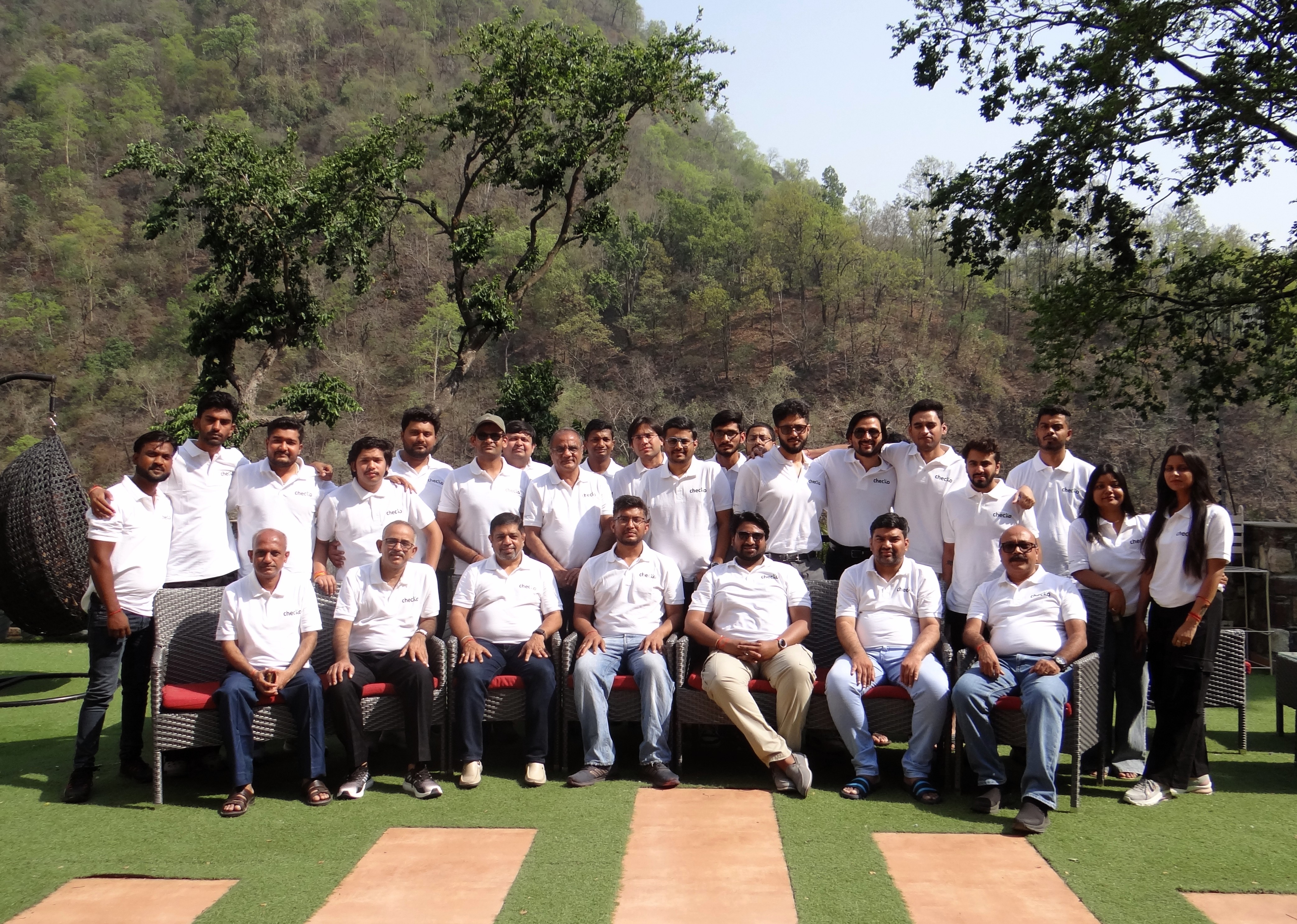 The Checko team with co-founder Satish Chandra seated at the center.
