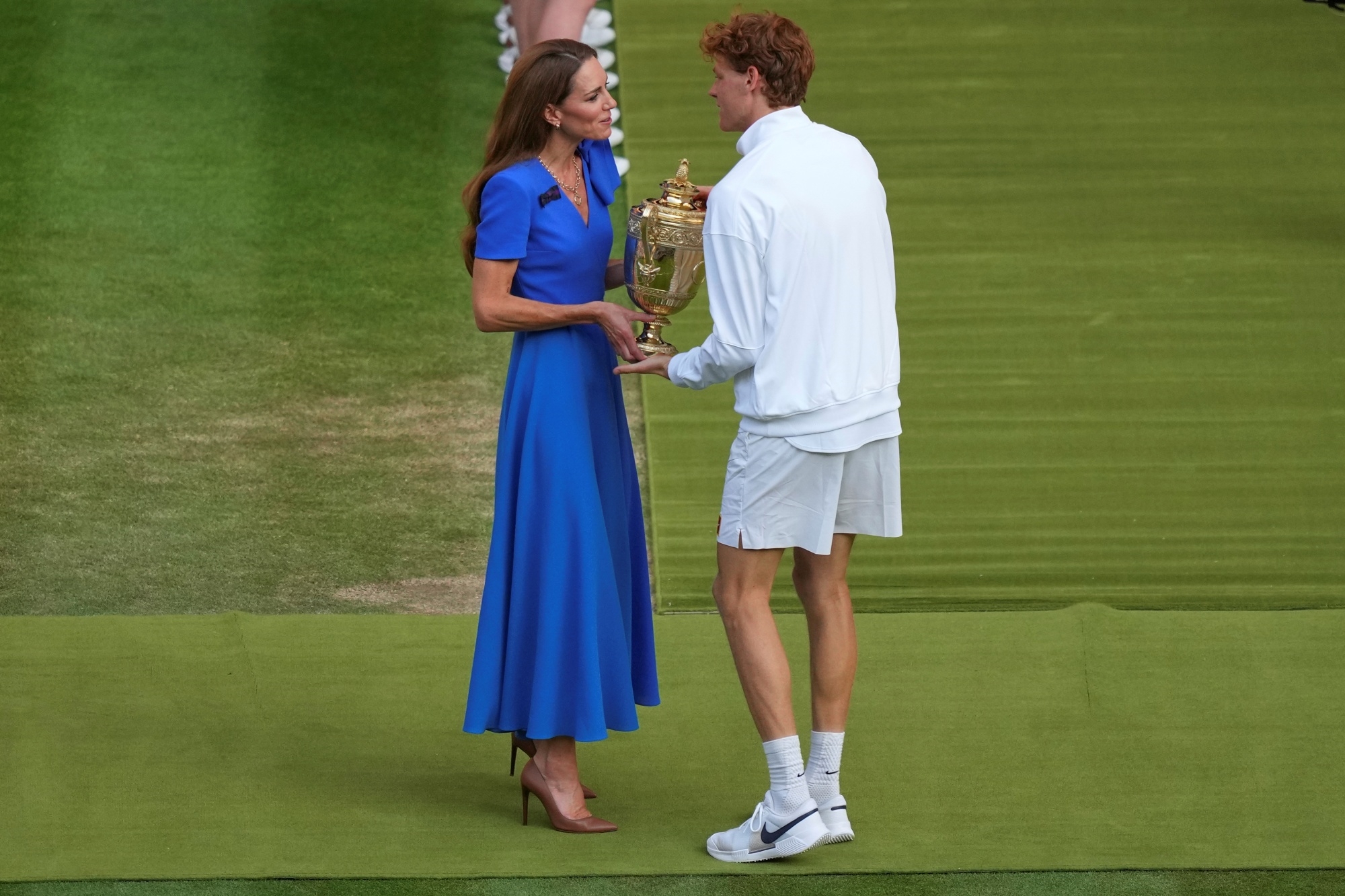 Italy's Jannik Sinner receives the trophy from Kate, Princess of Wales
