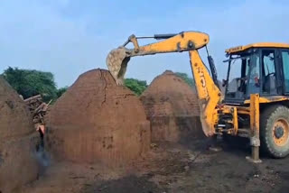 Bulldozer action against furnace