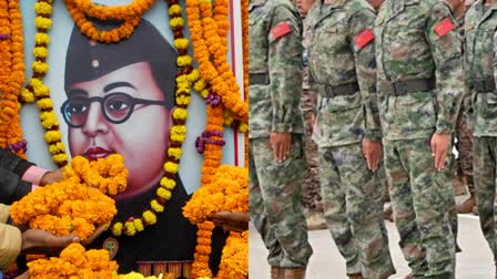 Netaji Sibhas Chandra Bose (L) and contingent of Indian Army soldiers