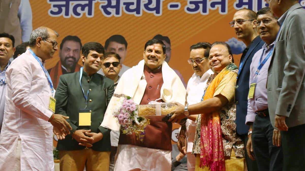 MP CM Mohan Yadav (in centre) at 'Catch The Rain' programme in Surat