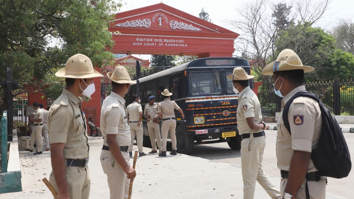 Police personnel near the entrance of Karnataka High Court