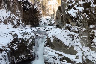 A view of the Aharbal waterfalls, also known as "Niagara Waterfall of Kashmir", covered with a layer of snow on a cold winter day, in Kulgam after fresh spell of snowfall