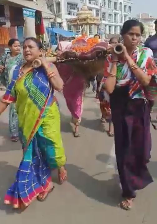 Daughters Carry Mother's Body