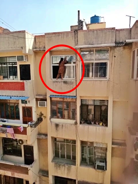 woman cleaning window glasses