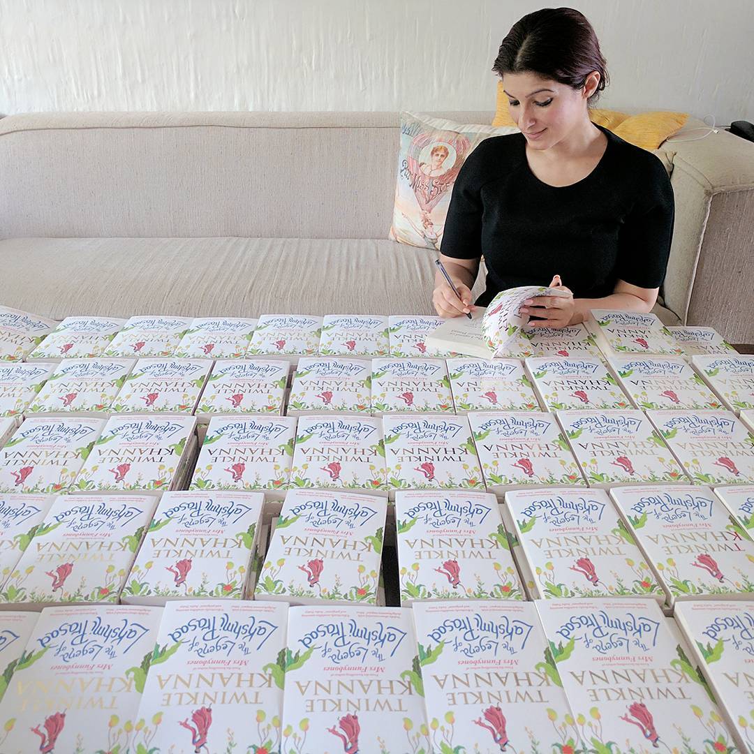 Twinkle Khanna signing 1000 copies copy of the Legend Of Lakshmi Prasad for a contest