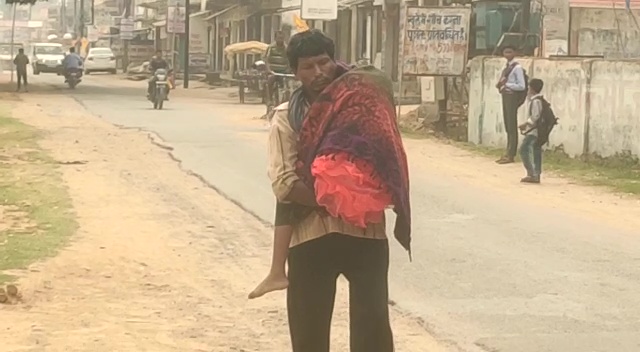 father-walks-carrying-daughter-body