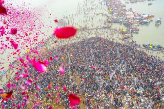 Flower petals being showered on devotees during the Maha Kumbh 2025