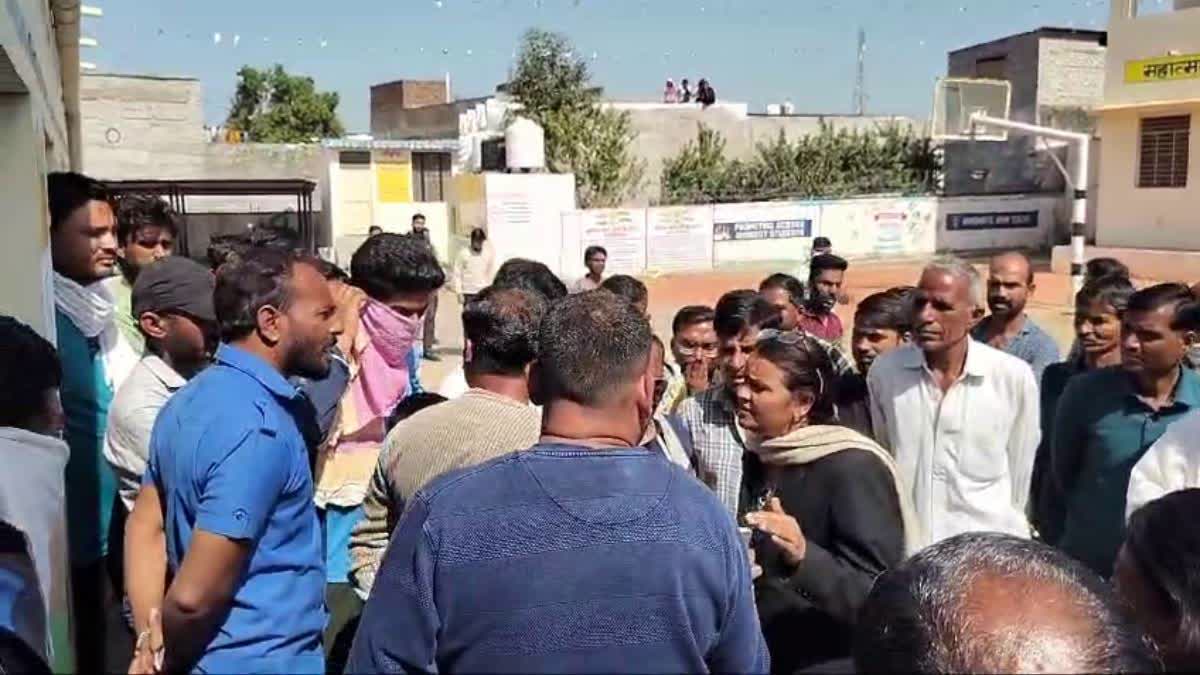 Crowd ghather at the government school in Kota after the incident.