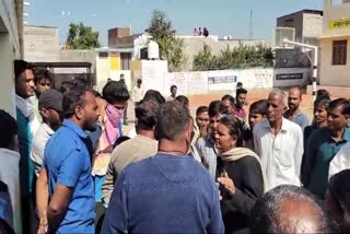 Crowd ghather at the government school in Kota after the incident.