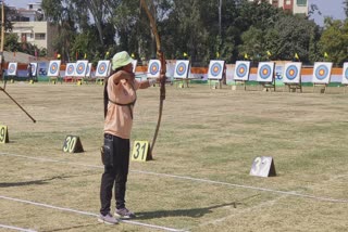 A Manipuri archer aims for the target.