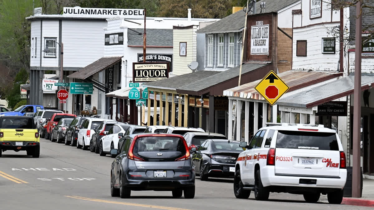 Cars drive on the main street in Julian, Calif. Monday, April 14, 2025, after an earthquake shook Southern California, sending boulders tumbling onto rural roadways outside San Diego and rattling items off shelves and walls.