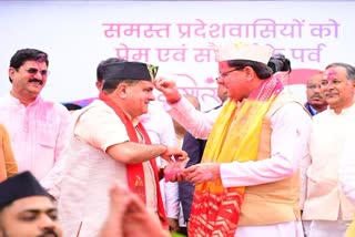 CM Dhami and BJP state president Mahendra Bhatt
